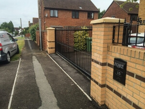 steel sliding straight top metal gates with finials street view
