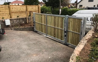 swinging flat top domestic automated wood fill galvanised metal framed gate bristol