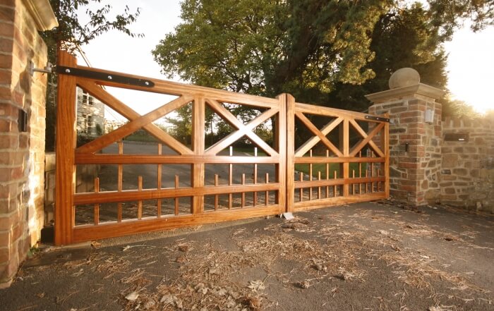 automated traditional wooden five bar driveway gate